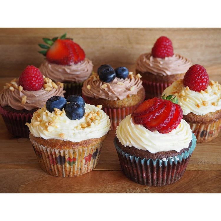 Low carb diabetic cupcakes with icing and berries